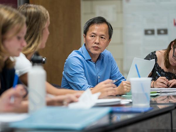 Professor Wan-chun Liu leads a discussion during a class session.
