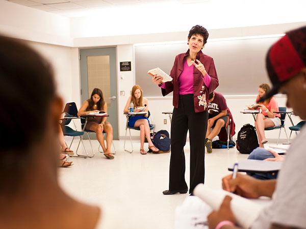 Professor Barbara Regenspan lectures an educational studies class.