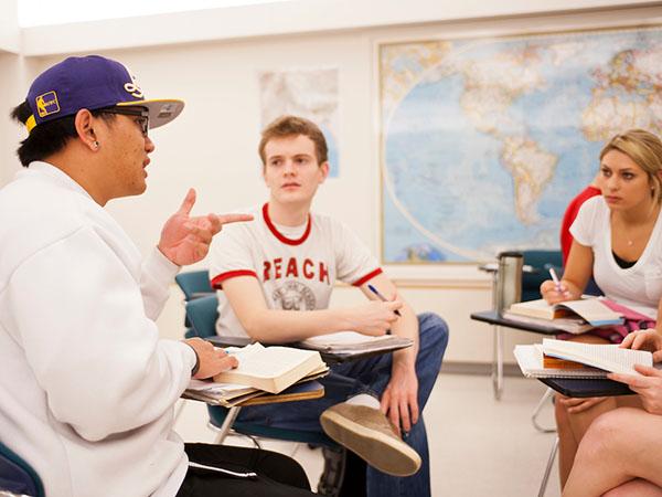 Colgate students participate in a group exercise  during an educational studies class.