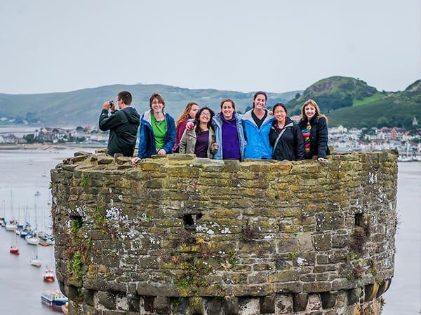 Colgate students visit the site of a medieval castle in Wales