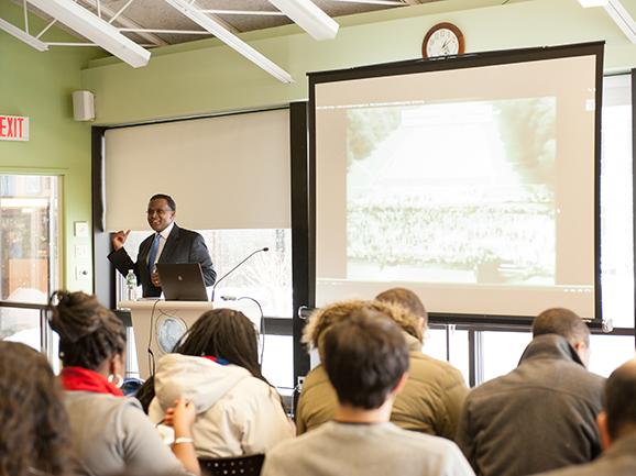Writing and rhetoric Professor Kermit Campbell addresses students and faculty in the ALANA Cultural Center