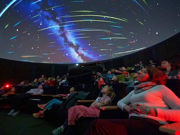 First graders from the Hamilton Central School district attend instructional events at the Ho Science Center, including a film showing at the Vis Lab