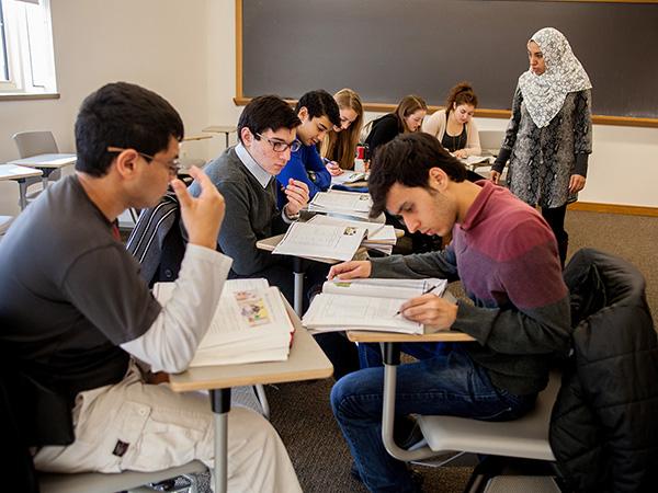 Students participate in group exercise during an Arabic language course