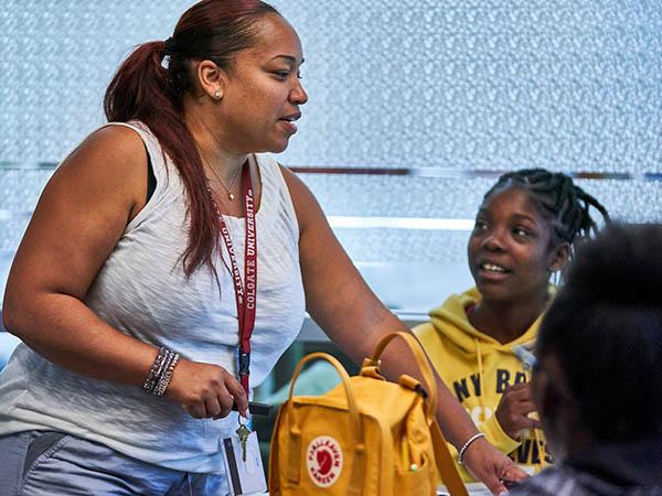 A Colgate graduate leads high school students through a workshop at the Ho Science Center, part of the Science, Technology, Engineering and Technology Summer Institute for students of color