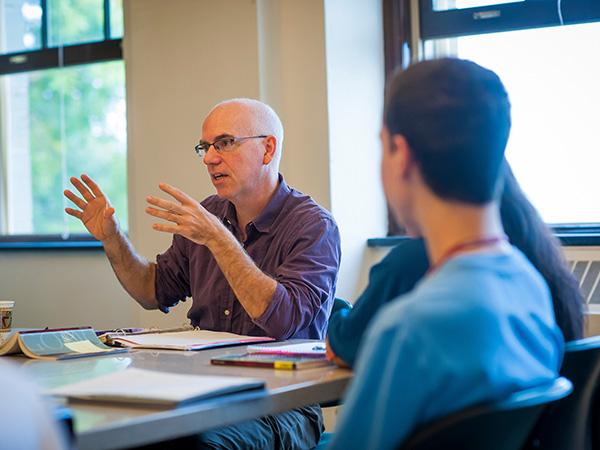 Professor McCabe holds a philosophy discussion in class