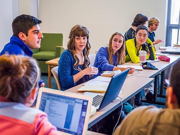 Students discuss a point in class in Drake Hall