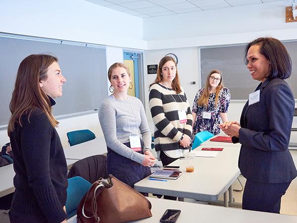 Female students talking with an alumna
