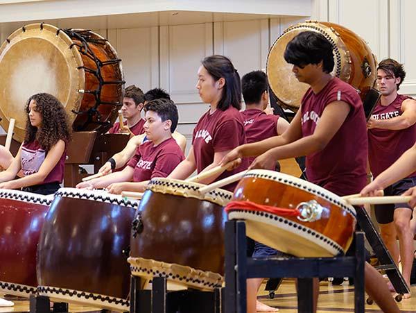 Students join visiting Taiko drummers in a hands-on demonstration