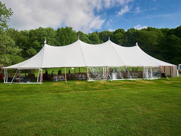 White tent being set up for an event on Whitnall Field