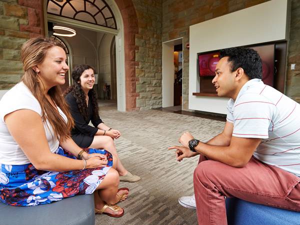 A prospective student speaks with an Admissions Intern at the Hurwitz Admission Center in James B. Colgate Hall.