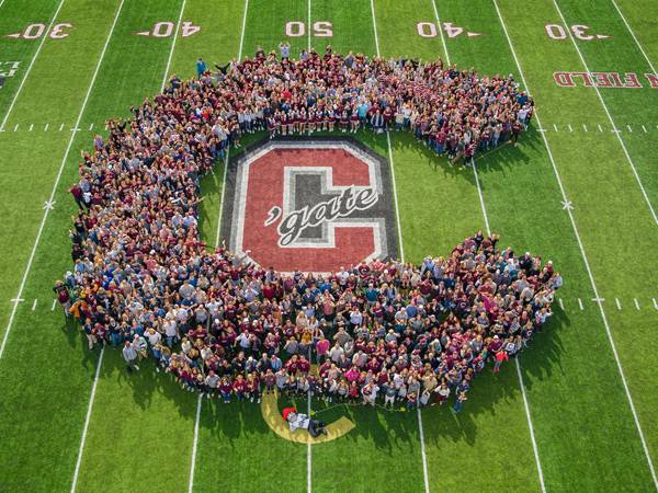 Colgate fans form a human C in the center of the field at the Bicentennial homecoming football game.