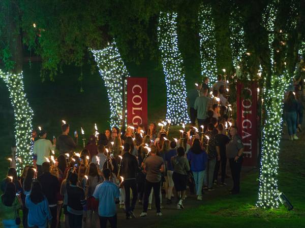 Alumni march down the hill and onto a lighted Willow Path in torchlight procession during the Bicentennial all-class reunion.
