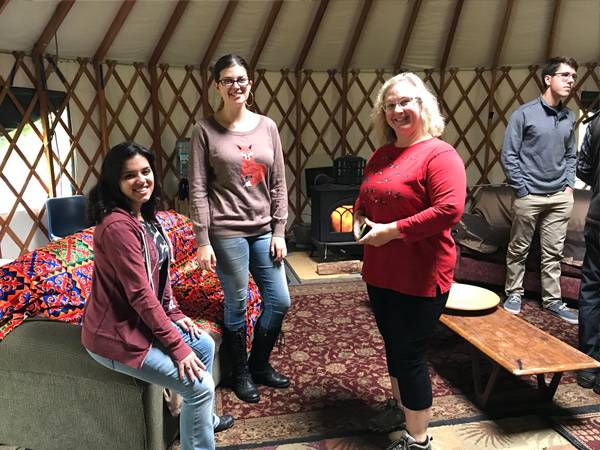 Faculty and students at a REST gathering at the Colgate yurt