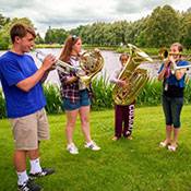 Colgate student playing instruments ouside
