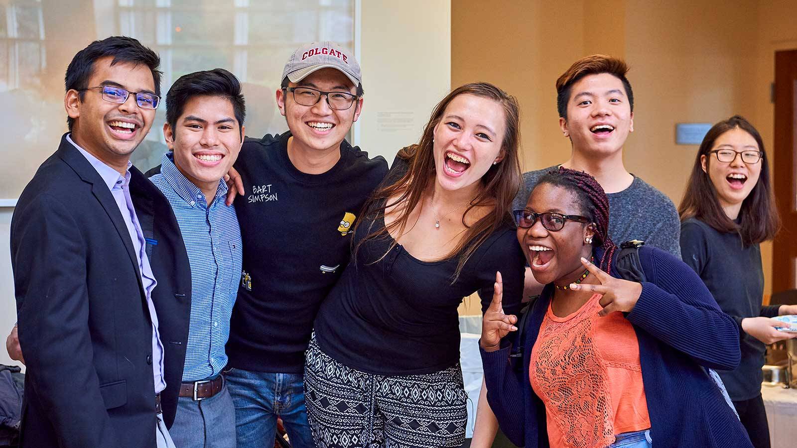 A group of international students at Colgate pose for a group photo together