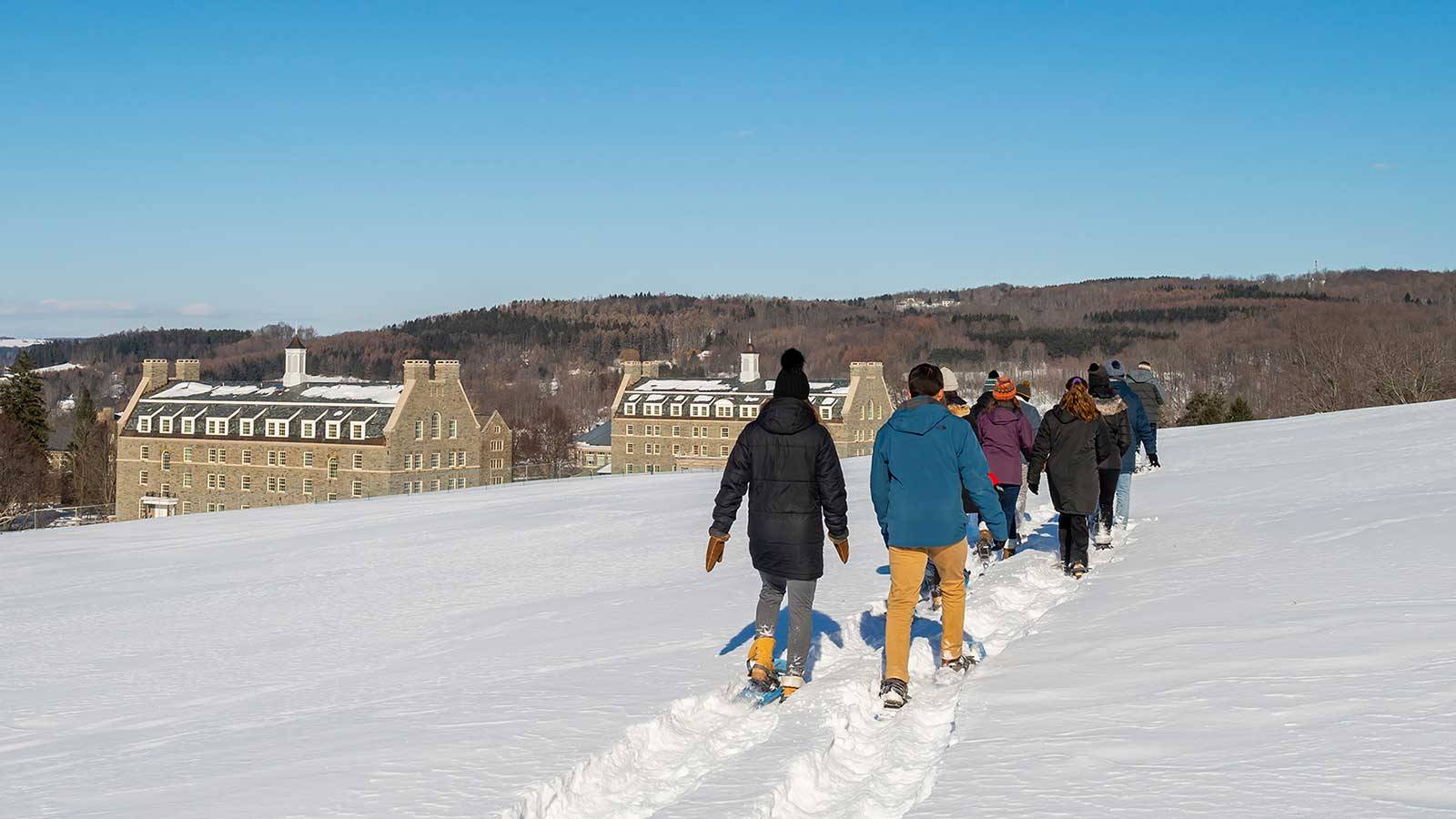 Students snowshoe on campus