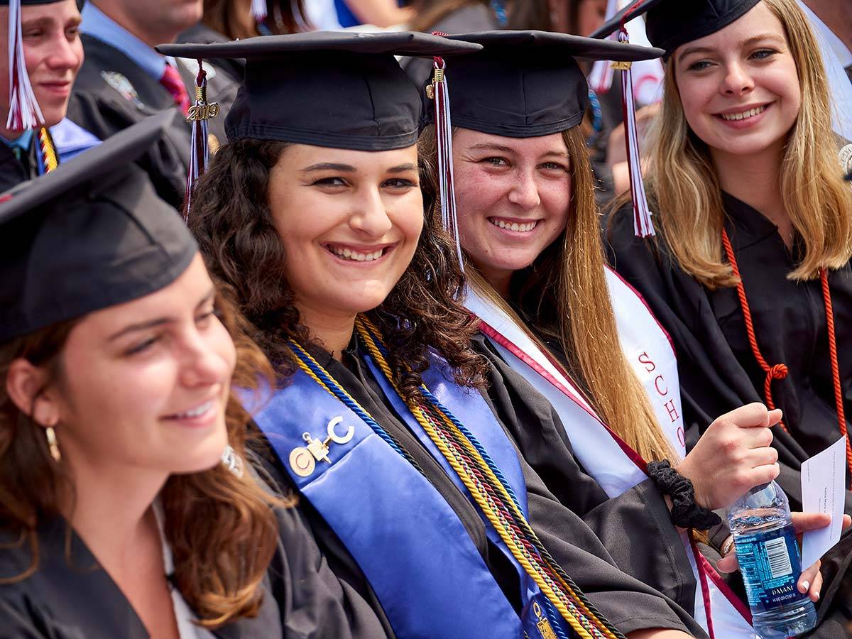 Graduating Colgate seniors in caps at gowns at the Commencement ceremony