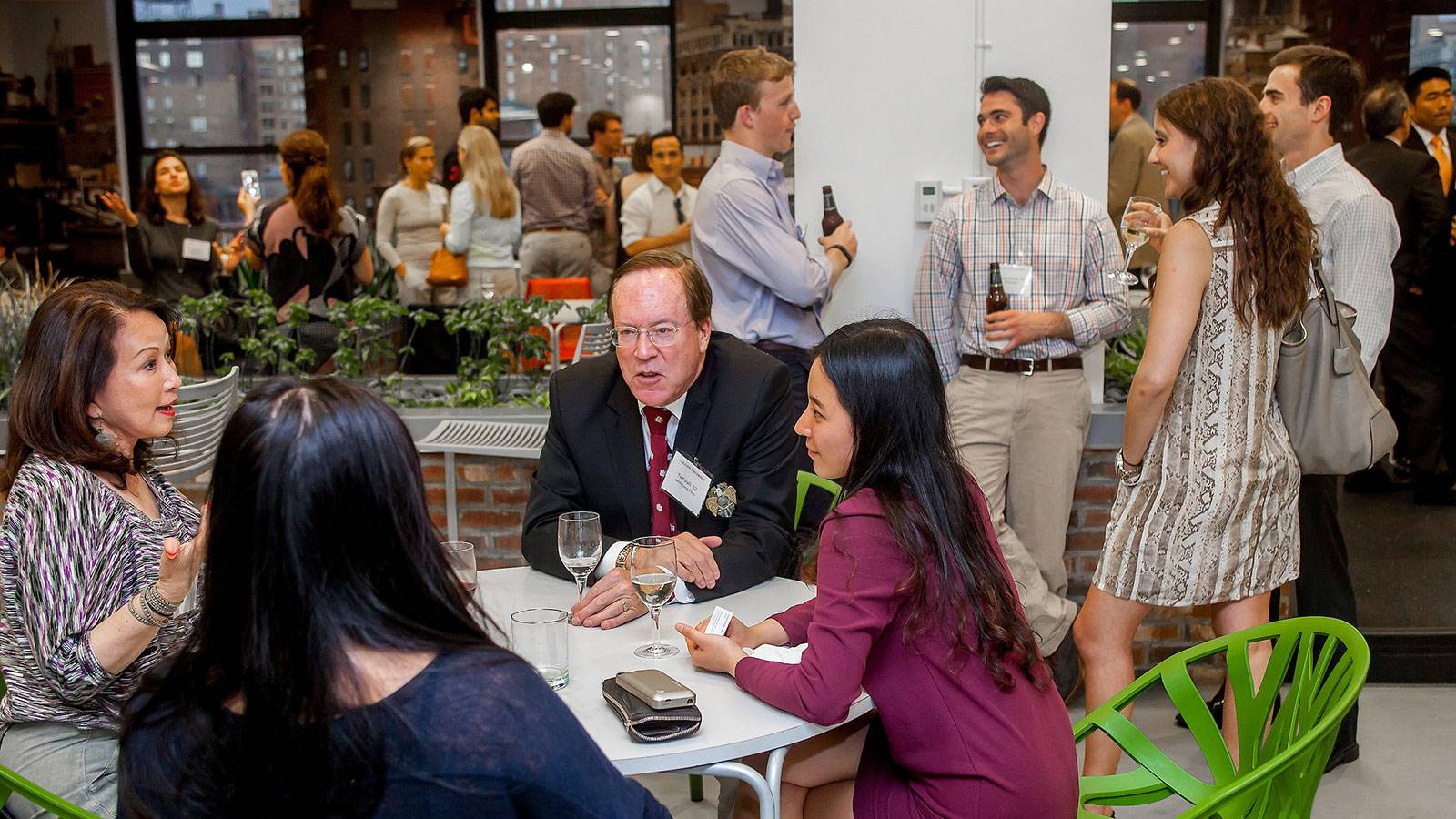 networking groups conversing over drinks