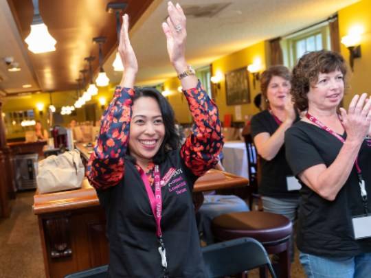 Colgate WoLF members clapping at an event in Donovan's Pub