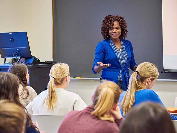 Professor Ynesse Abdul-Malak teaching in a classroom