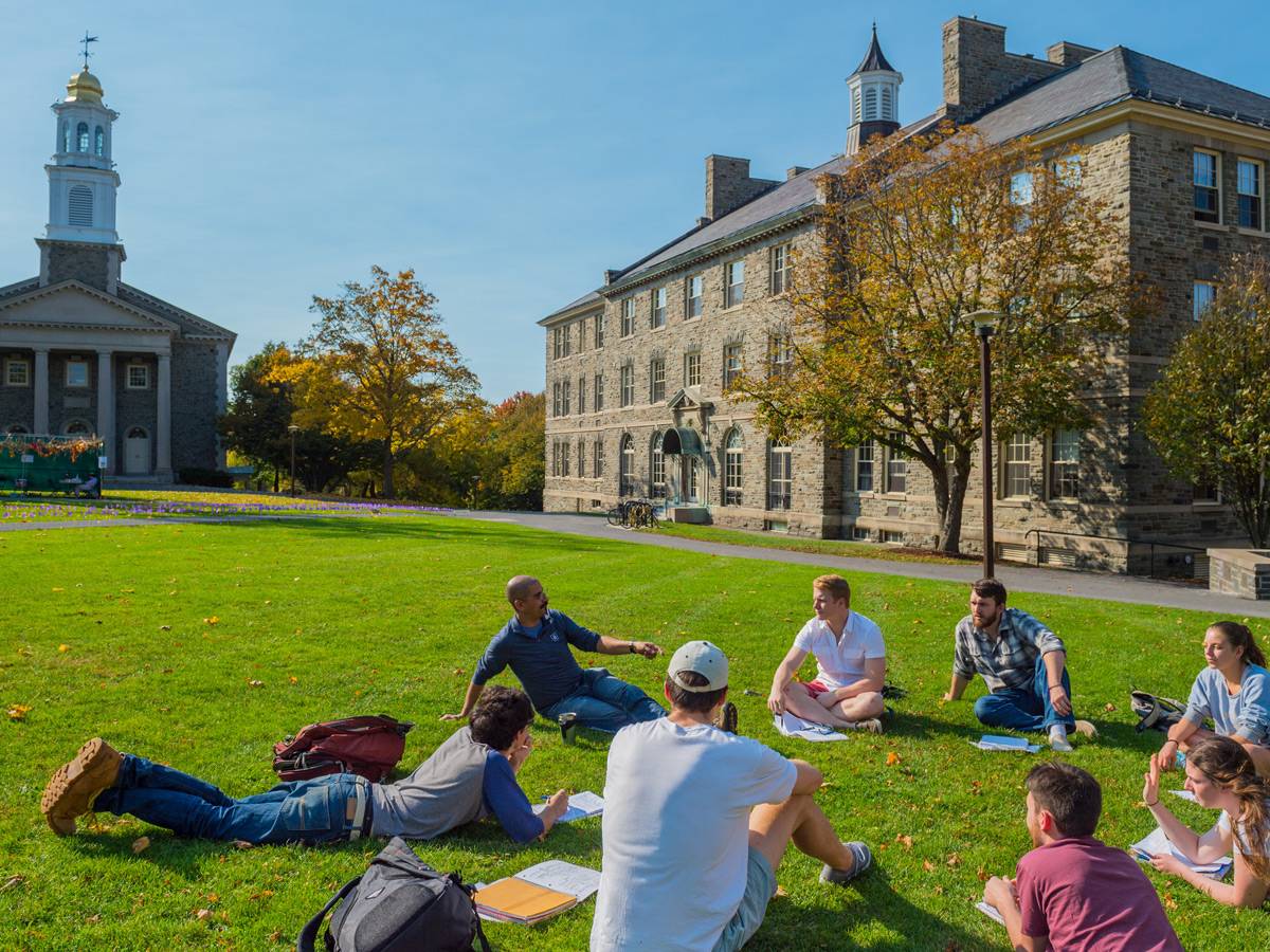 Students having class outside on the academic quad.