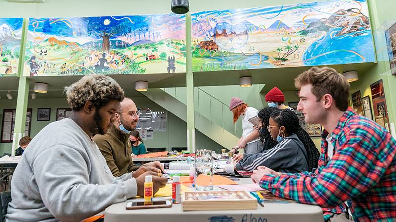 Students working on crafts during an LGBTQ+ program