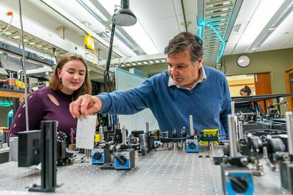 Two people work in lab