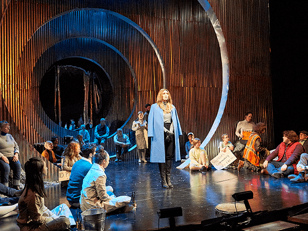 Students performing Antigone on stage
