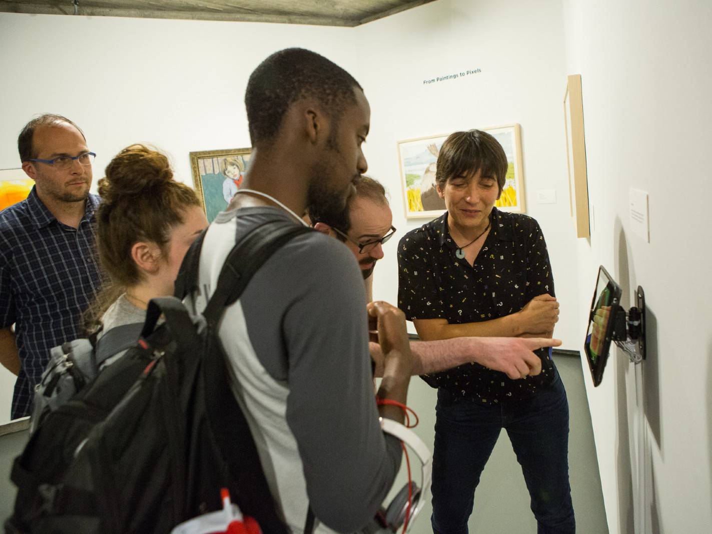 A professor and their class visit the gallery