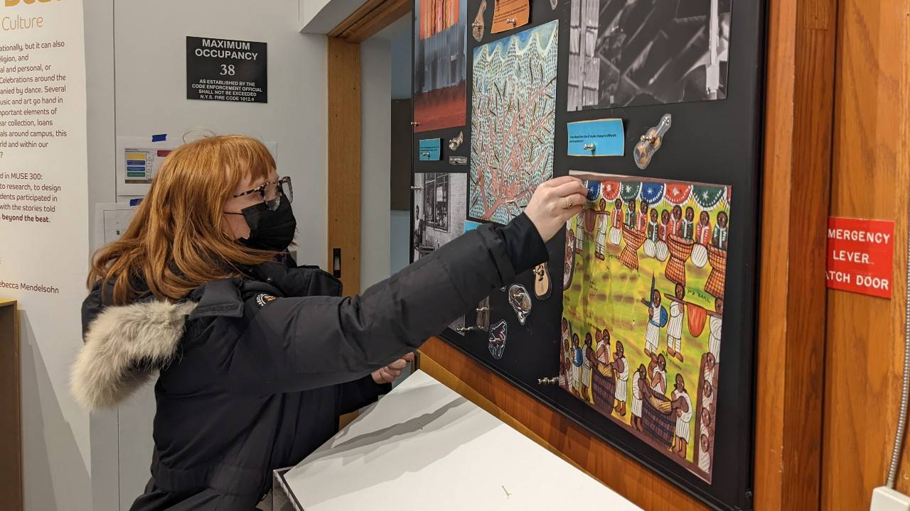 Student posts info on board