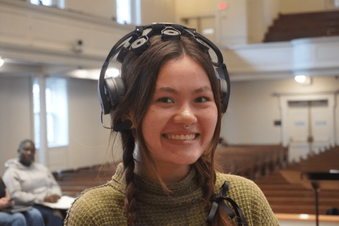 A student smiling in the Memorial Chapel
