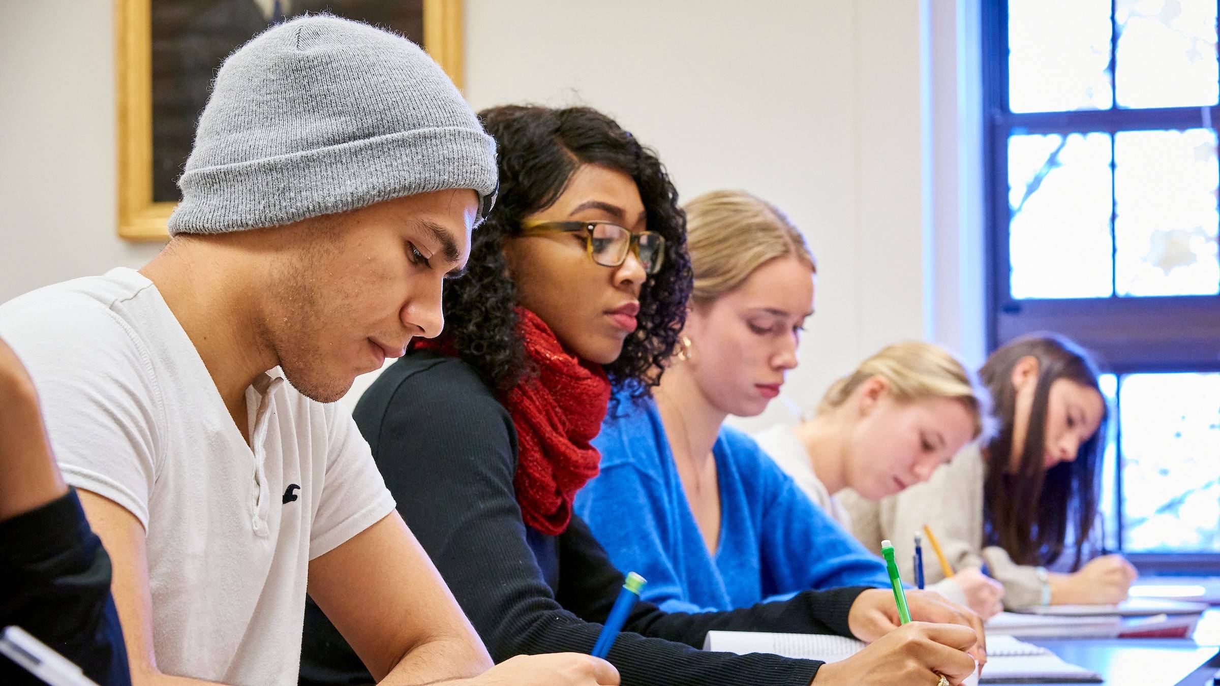 Students write notes in class