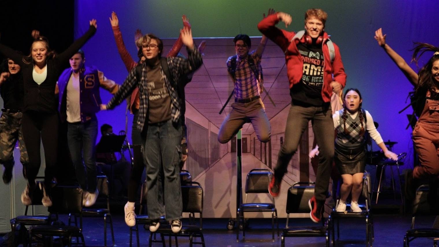 Corrigan performing in Masque & Triangle’s "Be More Chill" musical in 2024
