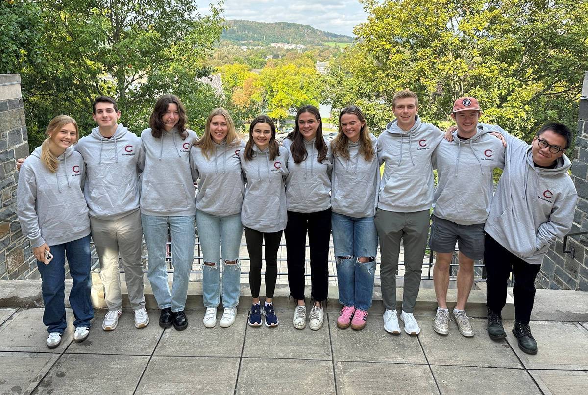 Students pose for photo on campus