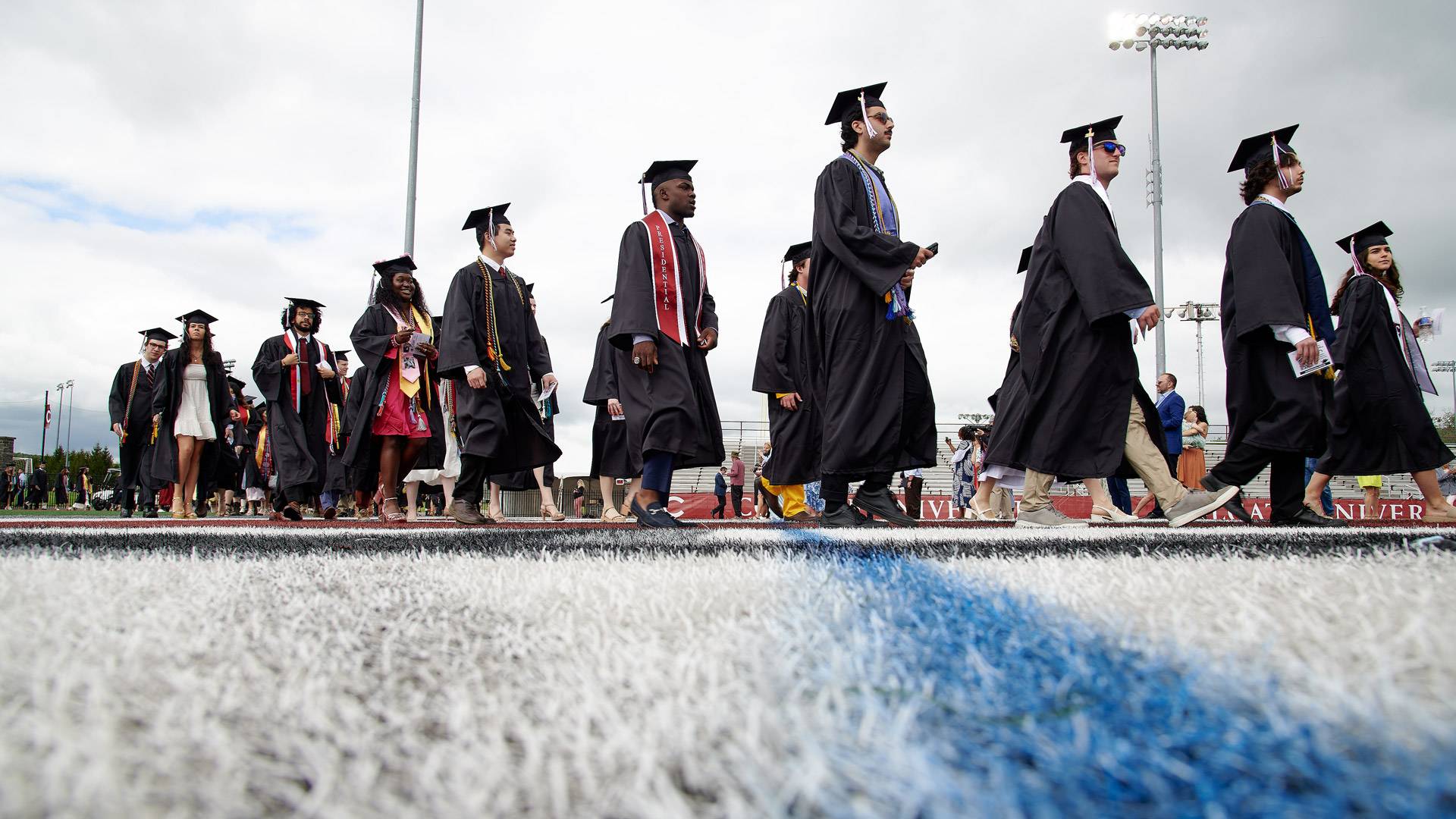 Students walking at Commencement.