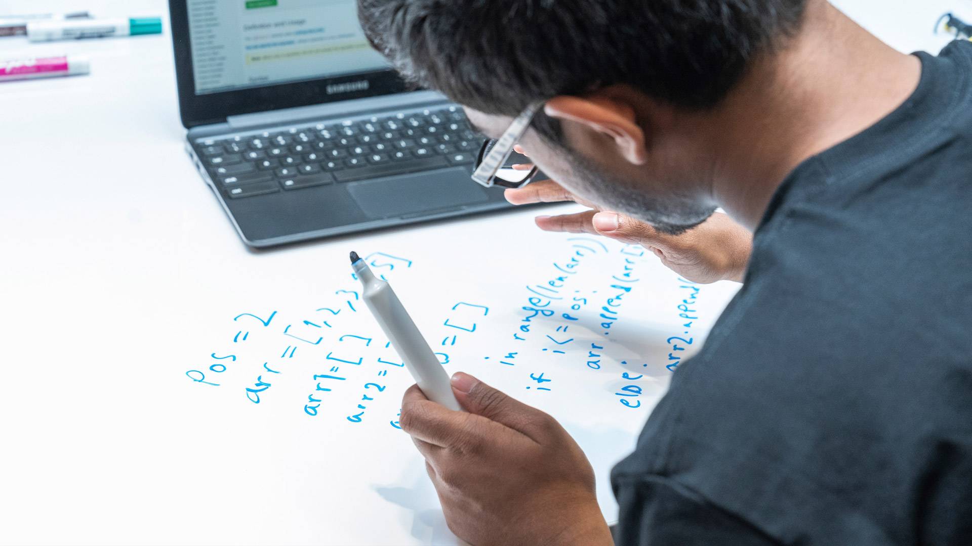 Student working on a board