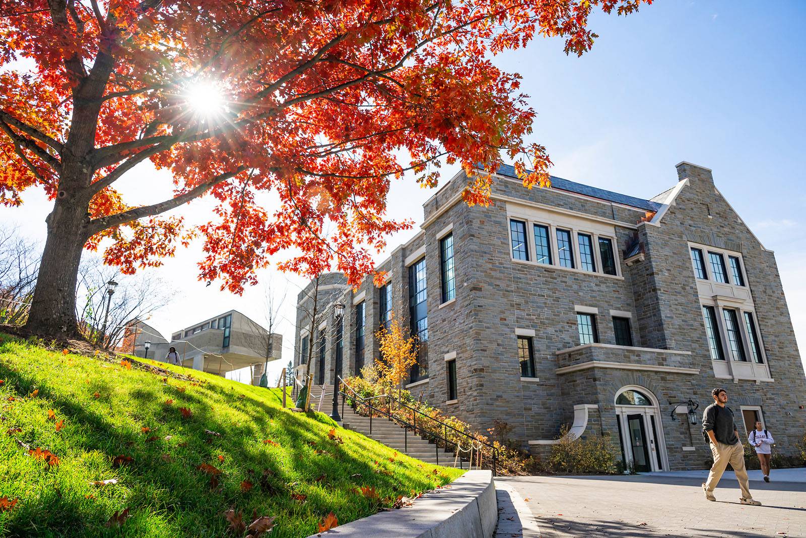 Students walk past Bernstein Hall in the fall