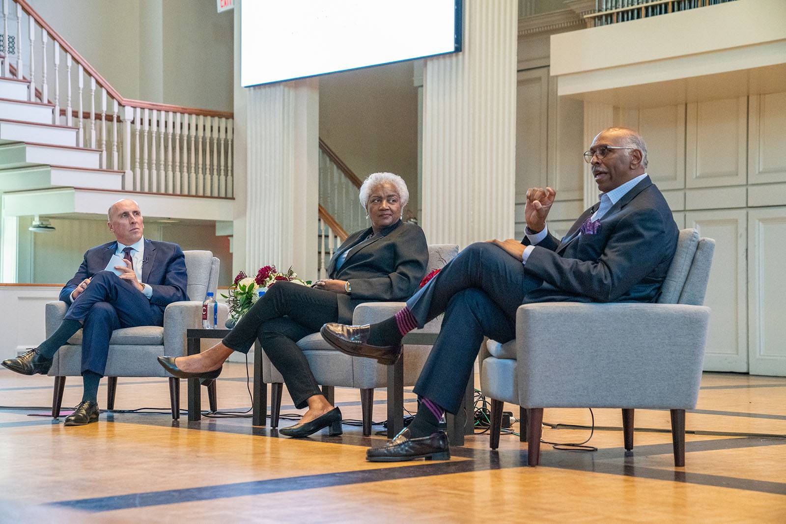President Casey and two guests on stage