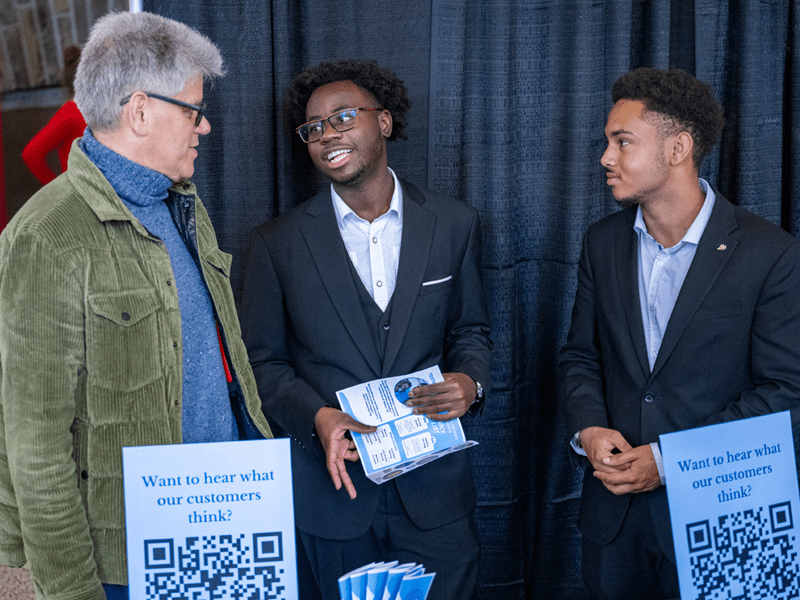 A photo of venture founders Nathan Walsh and Christopher Madden with program mentor Paul Wigdor