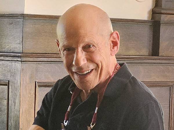 A headshot photo of Andy Greenfield