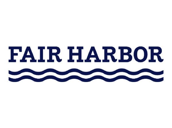 The words Fair Harbor with two wavy lines underneath to symbolize water