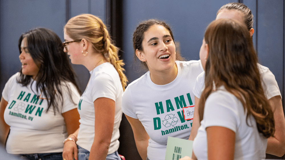 Members of the Hami Down campus venture talking with each other.