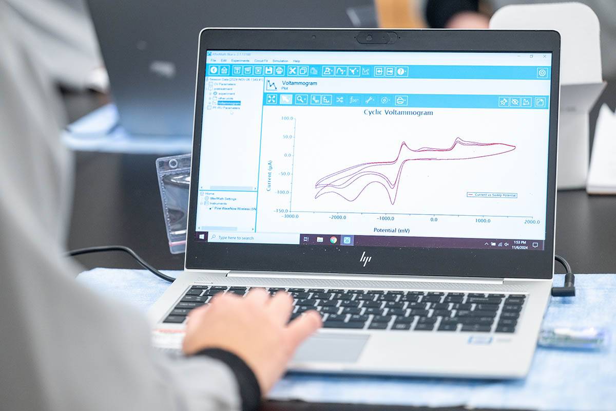 A student works on a laptop