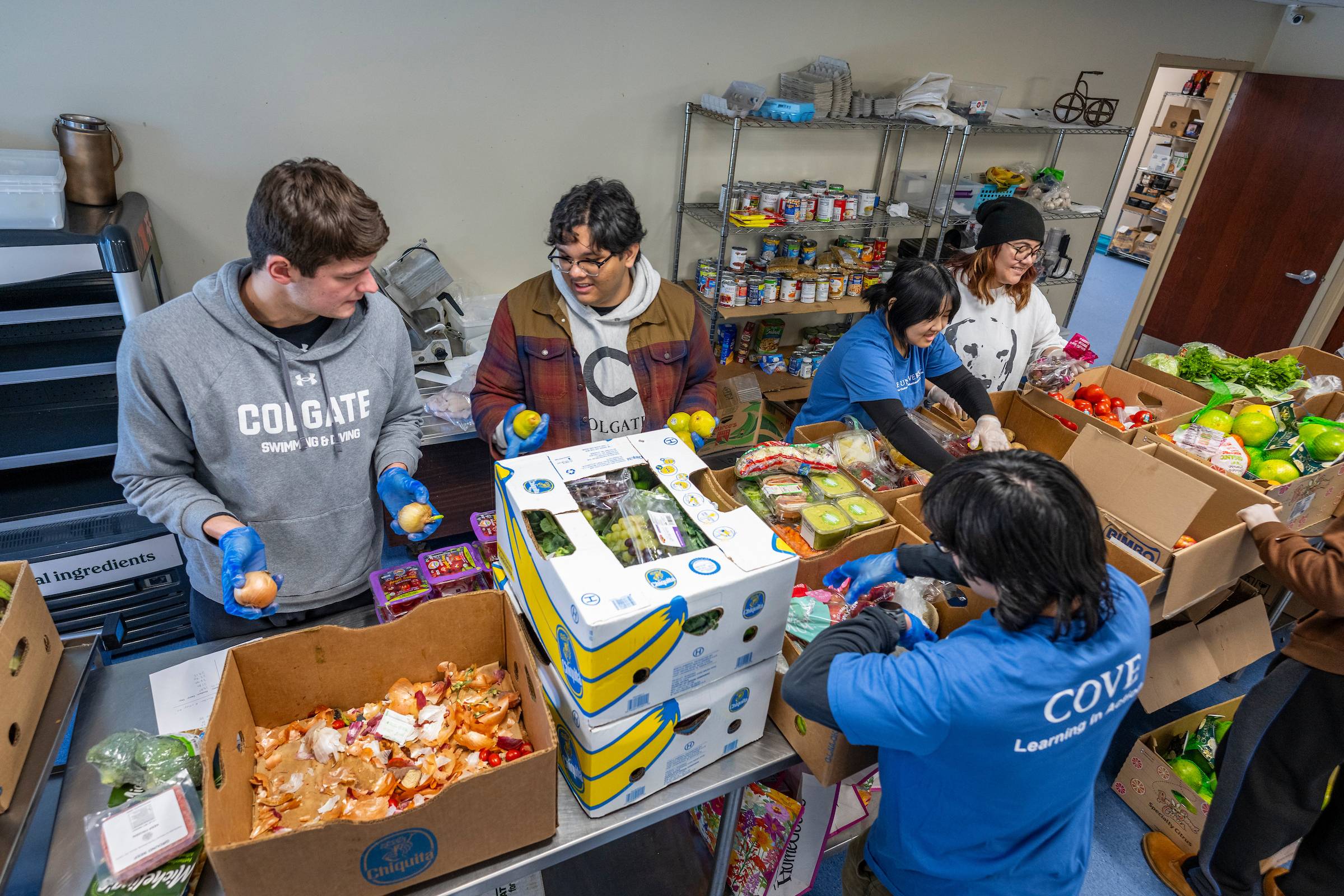 Student volunteers team up behind the scenes to pack and prepare goods for distribution
