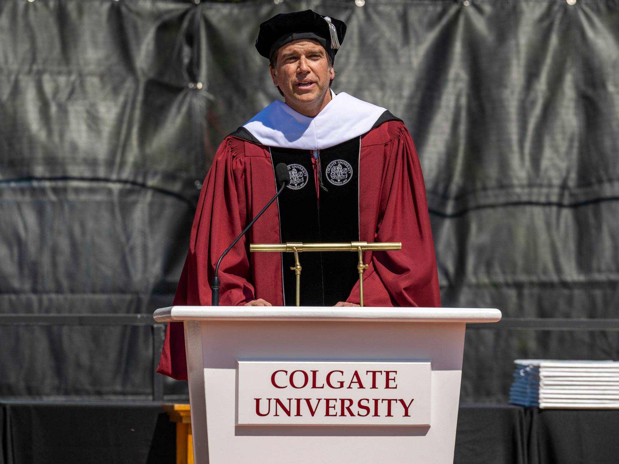 Ole Obermann speaks at podium