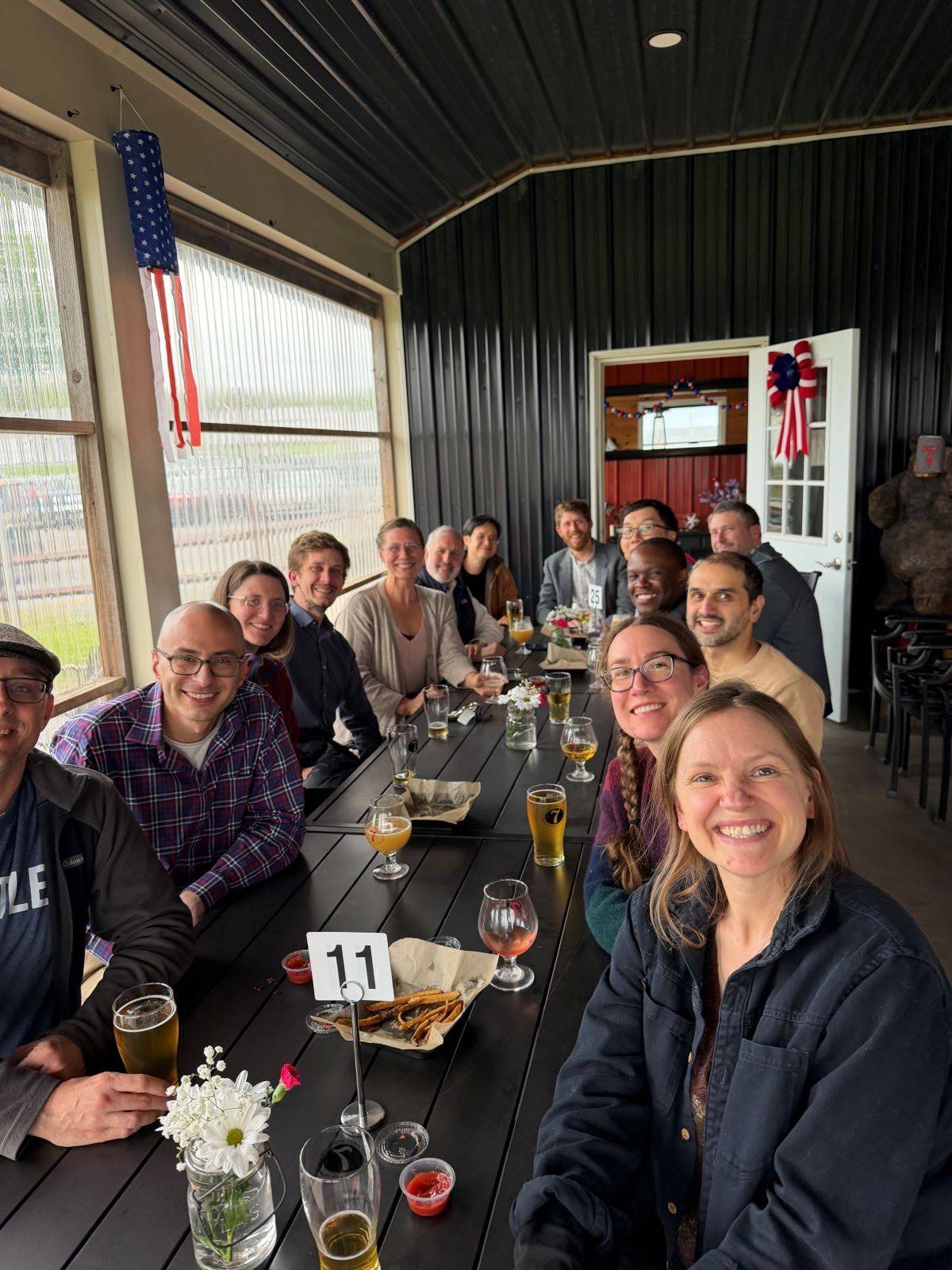 Image of Colgate-Hamilton Seminar participants with celebratory drinks