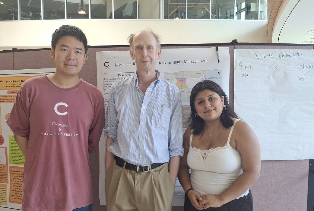 Luke Wang '27 with Professor William Meyer and Nathaly Tlaseca Verde '26 at summer research poster session.
