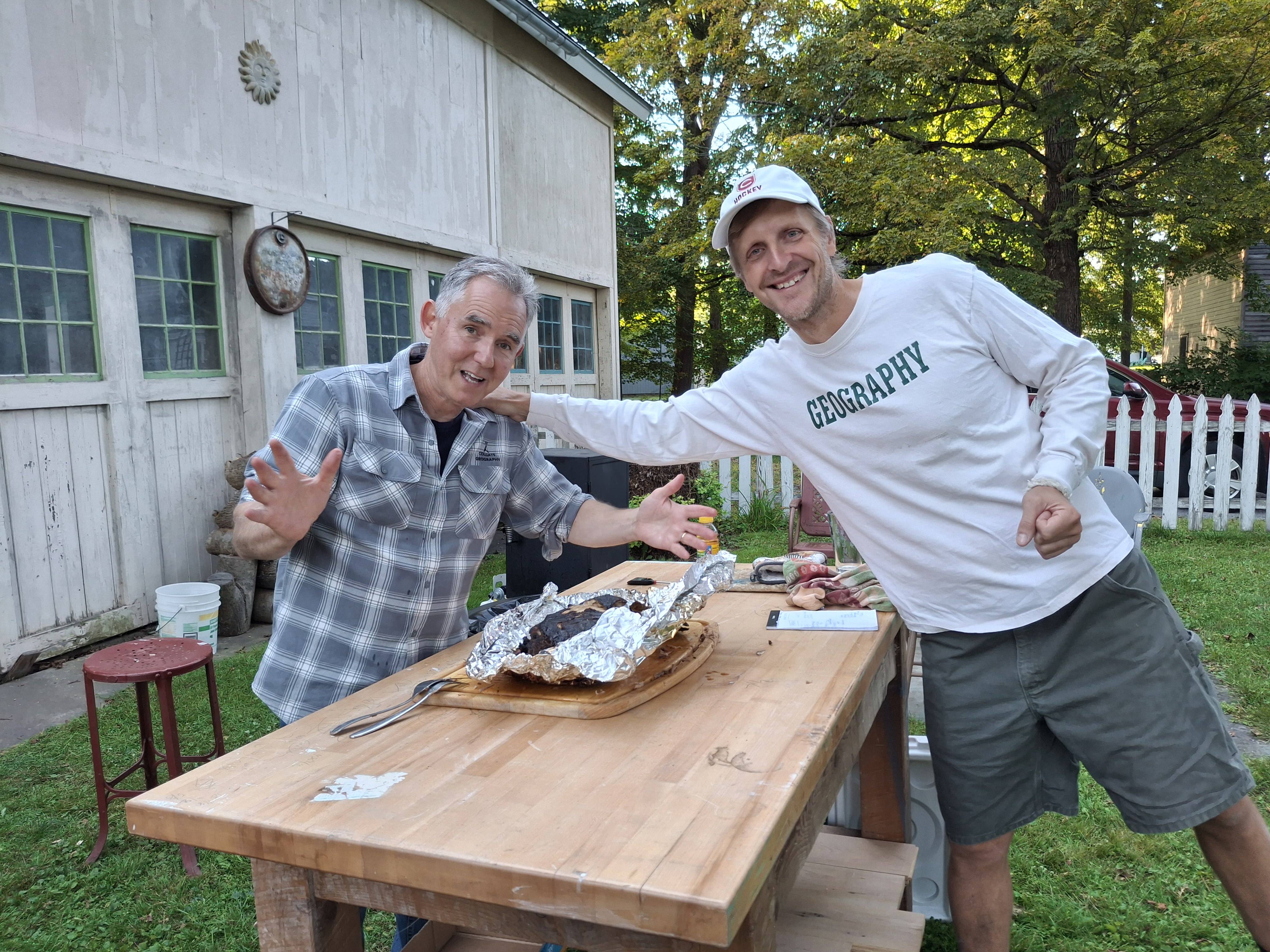 Professors Scull and Burnett considering a rack of ribs.