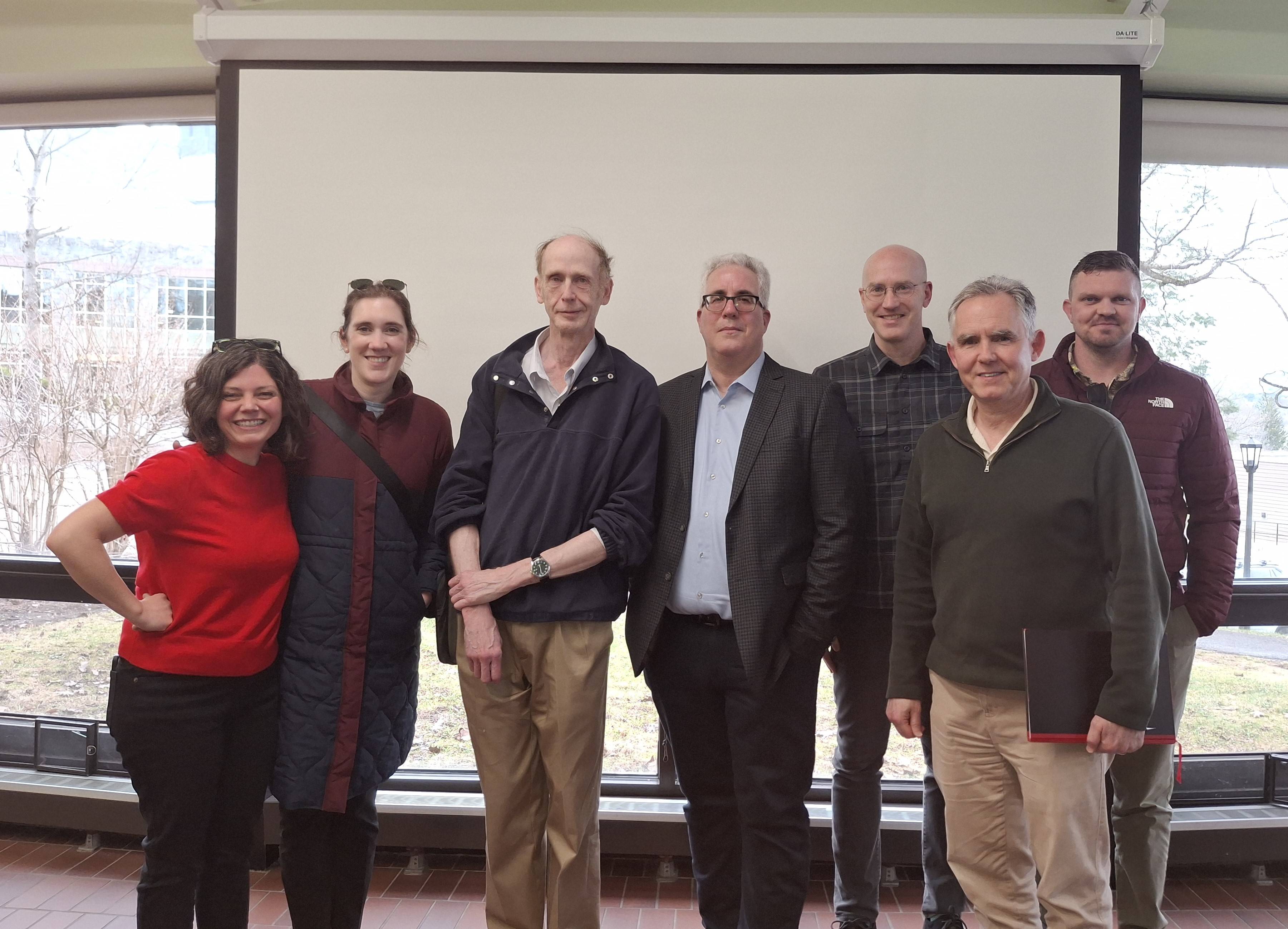 Geog Professors with Pierre Desrochers.  (L-R) Profs Emily Mitchell-Eaton, Madeline Hamlin, William Meyer, Pierre Desrochers, Peter Klepeis, Adam Burnett, and Justin Hartnett, at the Spring 2026 Gould Lecture.