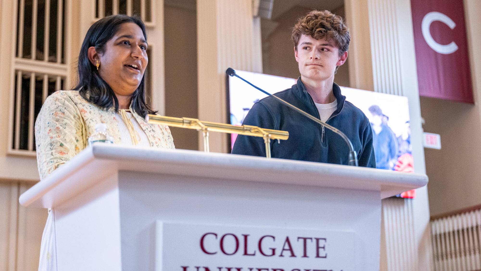 Harshitha Talasila and Robert Patch at podium